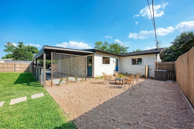 1314 Ridgemont Dr, Austin, TX 78723 - rear view of house featuring stone siding, a fenced backyard, and a patio