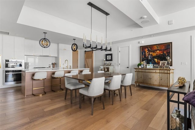70 Rainey St Unit 2106, Austin, TX 78701 - dining area with light wood-style flooring