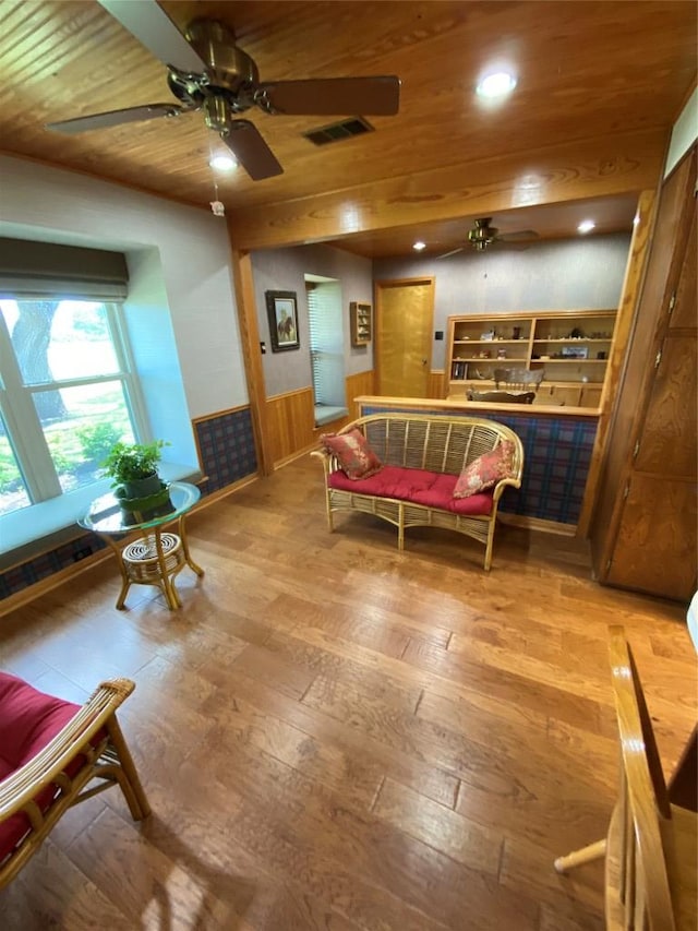 140 Oakridge Rd, Georgetown, TX 78628 - living room featuring a wainscoted wall, wood-type flooring, a ceiling fan, wood ceiling, and recessed lighting