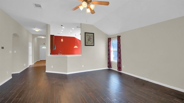 18409 Hees Ln, Pflugerville, TX 78660 - unfurnished living room with ceiling fan, arched walkways, wood finished floors, baseboards, and a sink