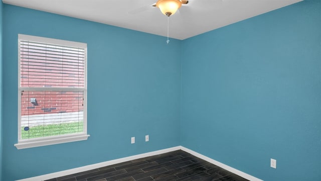 18409 Hees Ln, Pflugerville, TX 78660 - empty room featuring baseboards, a ceiling fan, and dark wood finished floors