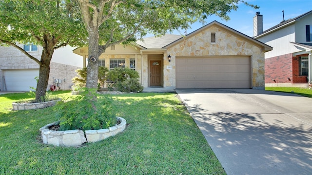 18409 Hees Ln, Pflugerville, TX 78660 - view of front of house featuring concrete driveway, stone siding, a garage, and a front yard
