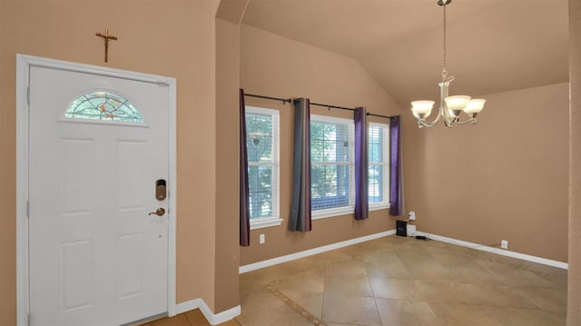 18409 Hees Ln, Pflugerville, TX 78660 - foyer with a chandelier, light tile patterned floors, baseboards, and vaulted ceiling