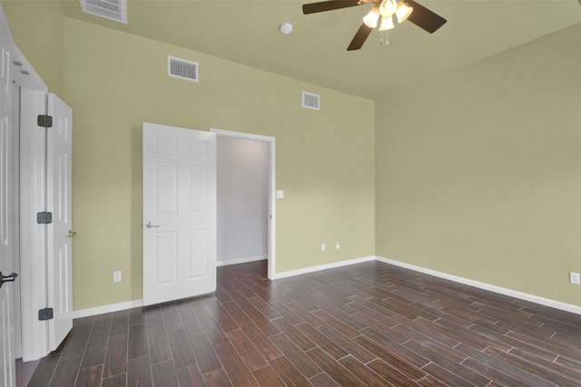 18409 Hees Ln, Pflugerville, TX 78660 - unfurnished bedroom with baseboards, dark wood-style floors, and ceiling fan