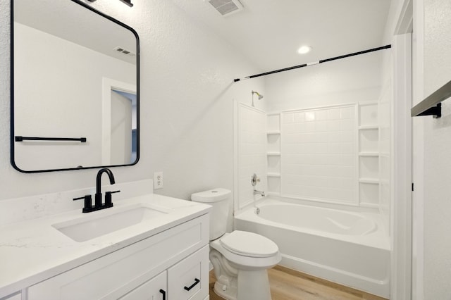 179 Pimlico, Kyle, TX 78640 - full bathroom with wood finished floors, vanity, toilet, and shower / bathtub combination