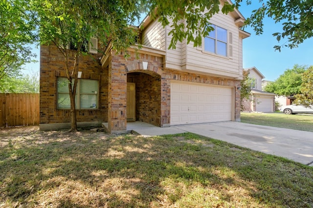 179 Pimlico, Kyle, TX 78640 - view of front of house with an attached garage, driveway, and brick siding