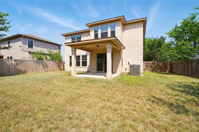 179 Pimlico, Kyle, TX 78640 - rear view of house with central AC unit and a patio area