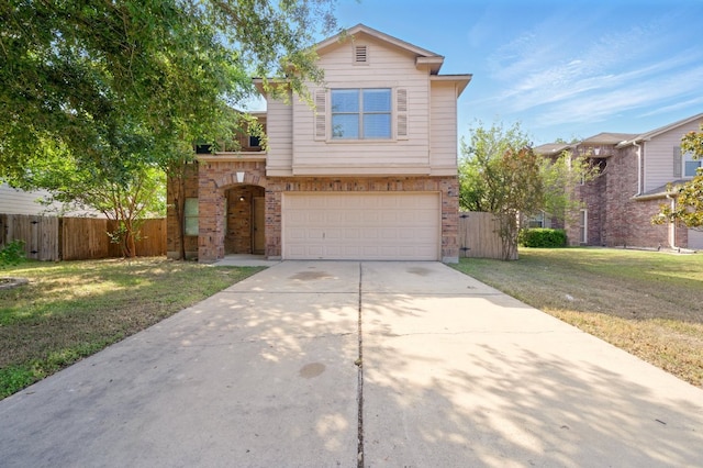 179 Pimlico, Kyle, TX 78640 - traditional-style house featuring an attached garage, concrete driveway, and brick siding
