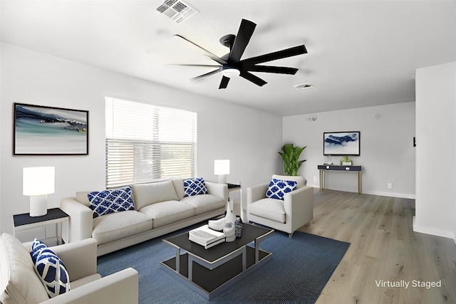 179 Pimlico, Kyle, TX 78640 - living area featuring light wood finished floors, ceiling fan, and baseboards