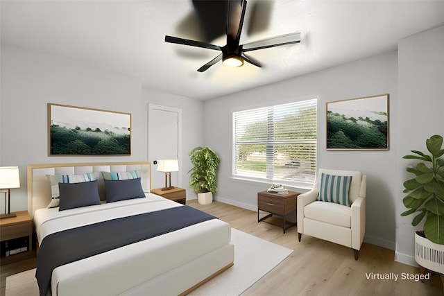 179 Pimlico, Kyle, TX 78640 - bedroom with light wood-type flooring, baseboards, and ceiling fan