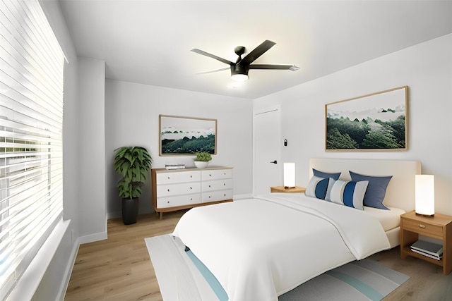 179 Pimlico, Kyle, TX 78640 - bedroom featuring light wood finished floors, ceiling fan, and baseboards