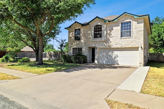 2511 Jacqueline Dr, Leander, TX 78641 - traditional-style house with stone siding, a garage, and driveway