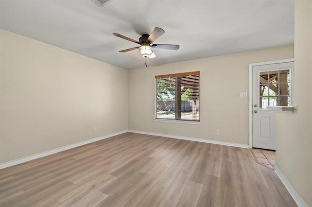 2511 Jacqueline Dr, Leander, TX 78641 - empty room featuring light wood-type flooring, a ceiling fan, and baseboards