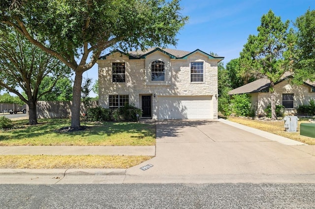 2511 Jacqueline Dr, Leander, TX 78641 - traditional-style home featuring stone siding, a garage, and concrete driveway