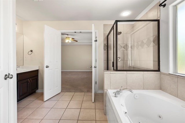 2511 Jacqueline Dr, Leander, TX 78641 - bathroom featuring a whirlpool tub, vanity, ceiling fan, tile patterned floors, and a stall shower