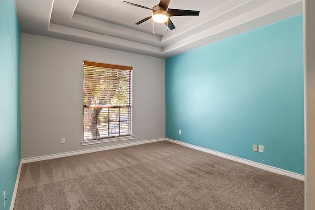2511 Jacqueline Dr, Leander, TX 78641 - carpeted empty room with a ceiling fan, a tray ceiling, and baseboards