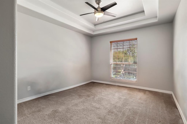 2511 Jacqueline Dr, Leander, TX 78641 - carpeted empty room featuring baseboards, a ceiling fan, and a tray ceiling
