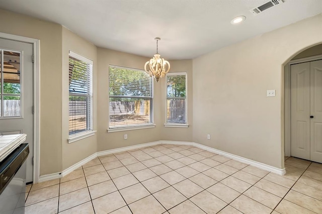 2511 Jacqueline Dr, Leander, TX 78641 - unfurnished dining area featuring a chandelier, arched walkways, light tile patterned floors, baseboards, and recessed lighting