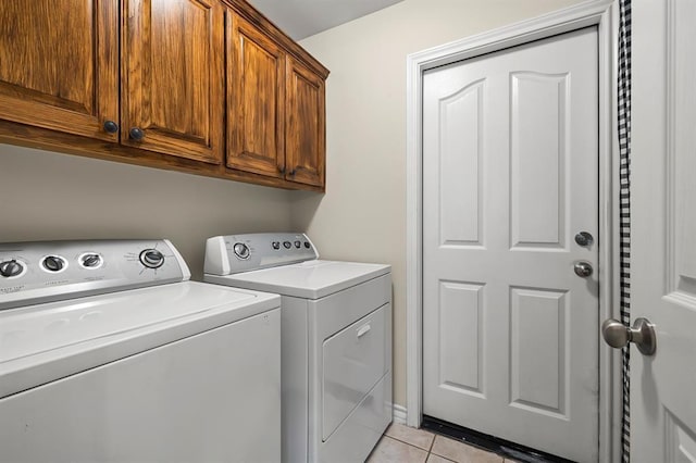 2511 Jacqueline Dr, Leander, TX 78641 - laundry room featuring independent washer and dryer, cabinet space, and light tile patterned floors