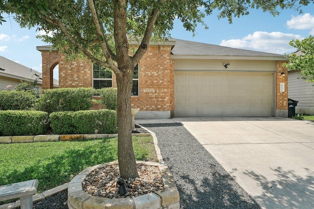 432 Druse Ln, Jarrell, TX 76537 - view of front facade with brick siding, a garage, and driveway