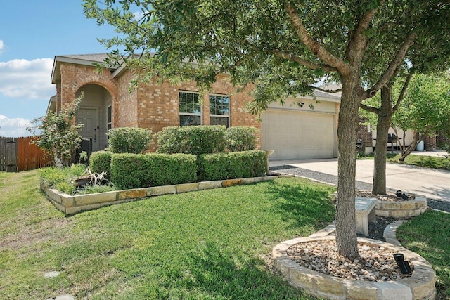 432 Druse Ln, Jarrell, TX 76537 - obstructed view of property with concrete driveway, brick siding, and an attached garage