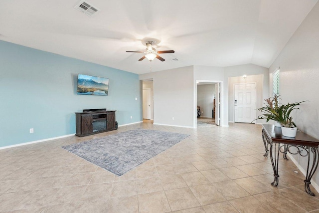 432 Druse Ln, Jarrell, TX 76537 - living room featuring ceiling fan, light tile patterned floors, baseboards, and lofted ceiling