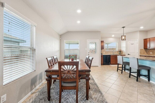 432 Druse Ln, Jarrell, TX 76537 - dining area with plenty of natural light, recessed lighting, light tile patterned floors, vaulted ceiling, and baseboards
