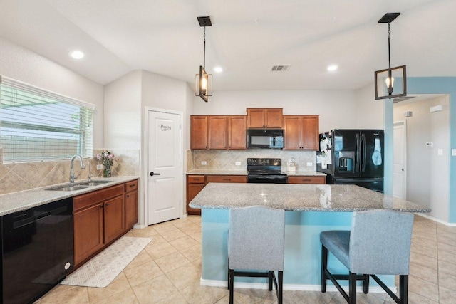 432 Druse Ln, Jarrell, TX 76537 - kitchen with black appliances, a sink, brown cabinetry, light tile patterned flooring, and decorative backsplash