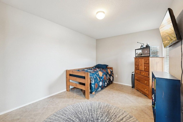 432 Druse Ln, Jarrell, TX 76537 - bedroom with light tile patterned floors and baseboards