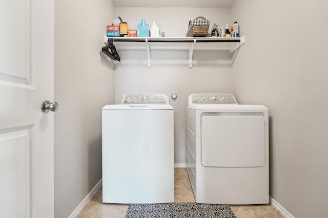432 Druse Ln, Jarrell, TX 76537 - laundry room with separate washer and dryer, light tile patterned floors, and baseboards