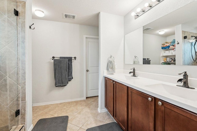 432 Druse Ln, Jarrell, TX 76537 - full bathroom featuring double vanity, tiled shower, baseboards, and tile patterned floors