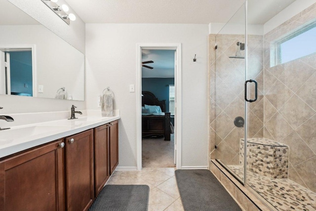 432 Druse Ln, Jarrell, TX 76537 - full bathroom with ensuite bath, double vanity, a stall shower, tile patterned floors, and healthy amount of natural light
