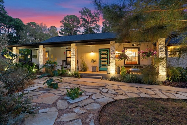 259 Akaloa Dr, Bastrop, TX 78602 - view of front of property with covered porch and stone siding