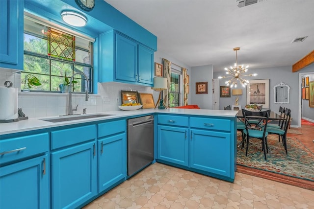 259 Akaloa Dr, Bastrop, TX 78602 - kitchen featuring dishwasher, decorative backsplash, a peninsula, and a chandelier