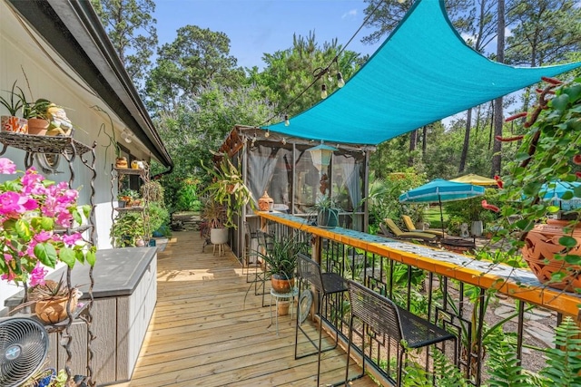 259 Akaloa Dr, Bastrop, TX 78602 - wooden deck with a sunroom