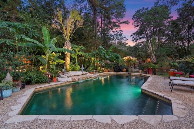 259 Akaloa Dr, Bastrop, TX 78602 - pool at dusk with an outdoor pool