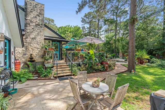 259 Akaloa Dr, Bastrop, TX 78602 - view of patio featuring outdoor dining space and a wooden deck