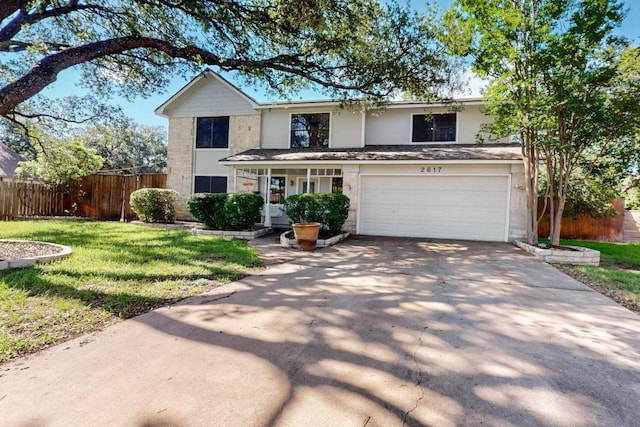 2617 Chowan Cv, Round Rock, TX 78681 - traditional-style house featuring driveway, a garage, and covered porch