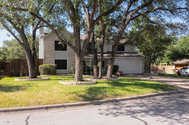 2617 Chowan Cv, Round Rock, TX 78681 - view of front of home featuring an attached garage, driveway, and stone siding