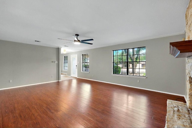 2617 Chowan Cv, Round Rock, TX 78681 - unfurnished living room featuring ceiling fan, wood finished floors, and ornamental molding