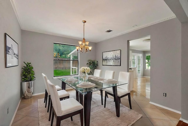 2617 Chowan Cv, Round Rock, TX 78681 - dining space featuring light tile patterned flooring, crown molding, and a chandelier