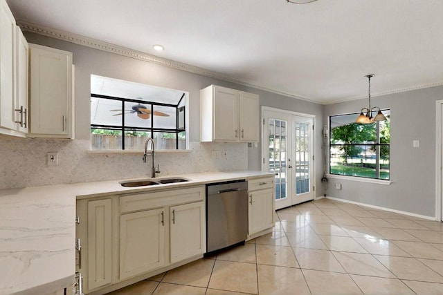 2617 Chowan Cv, Round Rock, TX 78681 - kitchen featuring stainless steel dishwasher, ornamental molding, tasteful backsplash, french doors, and light tile patterned flooring