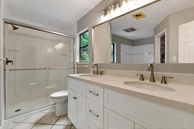 2617 Chowan Cv, Round Rock, TX 78681 - bathroom with a shower stall, double vanity, and tile patterned flooring