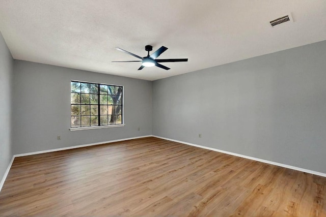 2617 Chowan Cv, Round Rock, TX 78681 - unfurnished room with wood finished floors and a ceiling fan