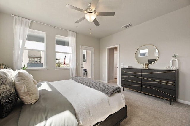 9015 Cattle Baron Path Unit 404, Austin, TX 78747 - bedroom with light colored carpet, baseboards, and a ceiling fan