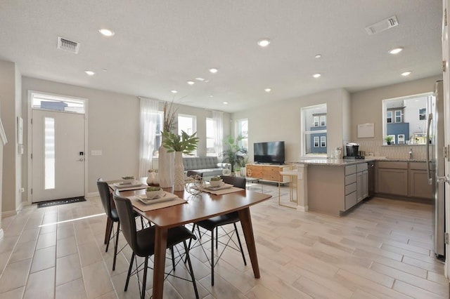 9015 Cattle Baron Path Unit 404, Austin, TX 78747 - dining space featuring recessed lighting, light wood-style flooring, and baseboards