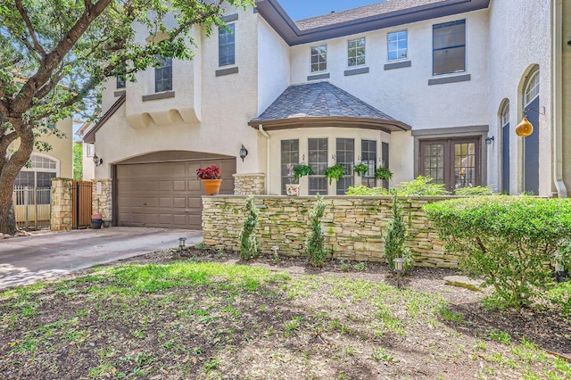 3824 Gaines Ct, Austin, TX 78735 - view of front facade with stucco siding, a garage, and concrete driveway