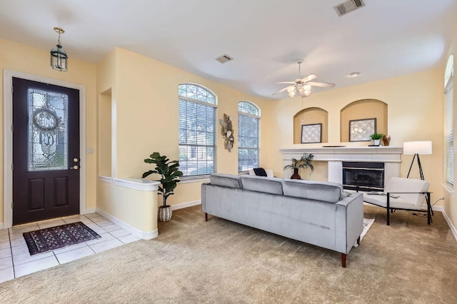 3824 Gaines Ct, Austin, TX 78735 - carpeted living room with a glass covered fireplace, tile patterned flooring, and ceiling fan