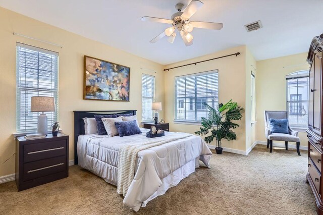 3824 Gaines Ct, Austin, TX 78735 - bedroom with light colored carpet and a ceiling fan