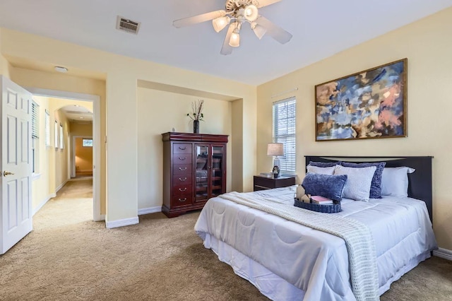 3824 Gaines Ct, Austin, TX 78735 - carpeted bedroom featuring arched walkways and ceiling fan